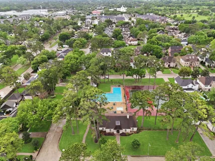 an aerial view of a houses with yard