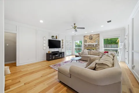 a living room with furniture and a flat screen tv