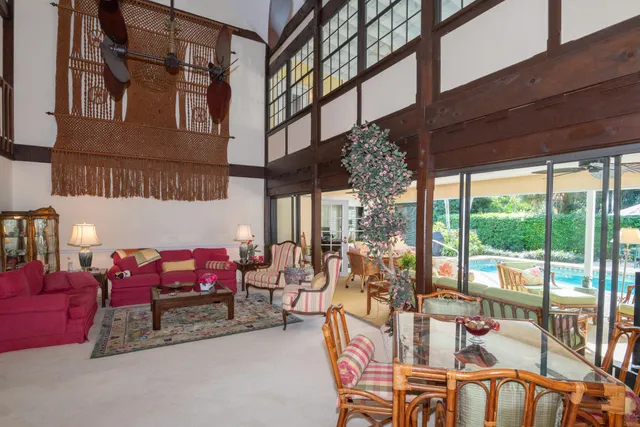 a house view with a sitting space and garden