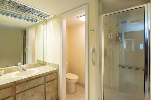 a bathroom with a double vanity sink and mirror