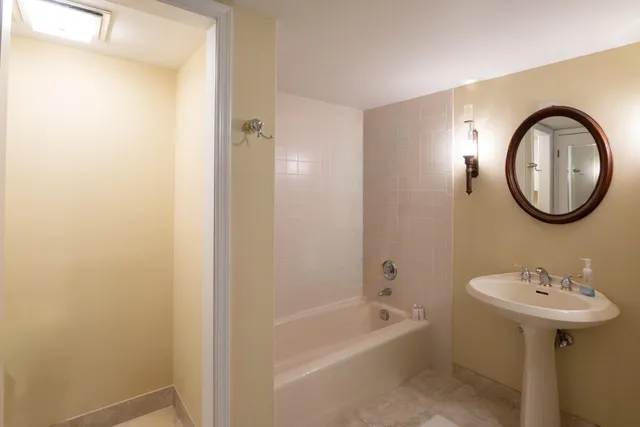 a bedroom with furniture and a window