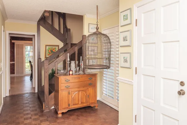 a bathroom with a granite countertop sink a toilet and a mirror