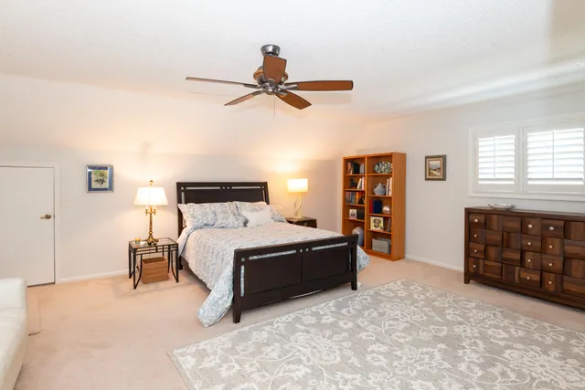 an aerial view of a house with a yard and garden