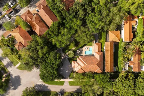 an aerial view of a house with a yard and garden