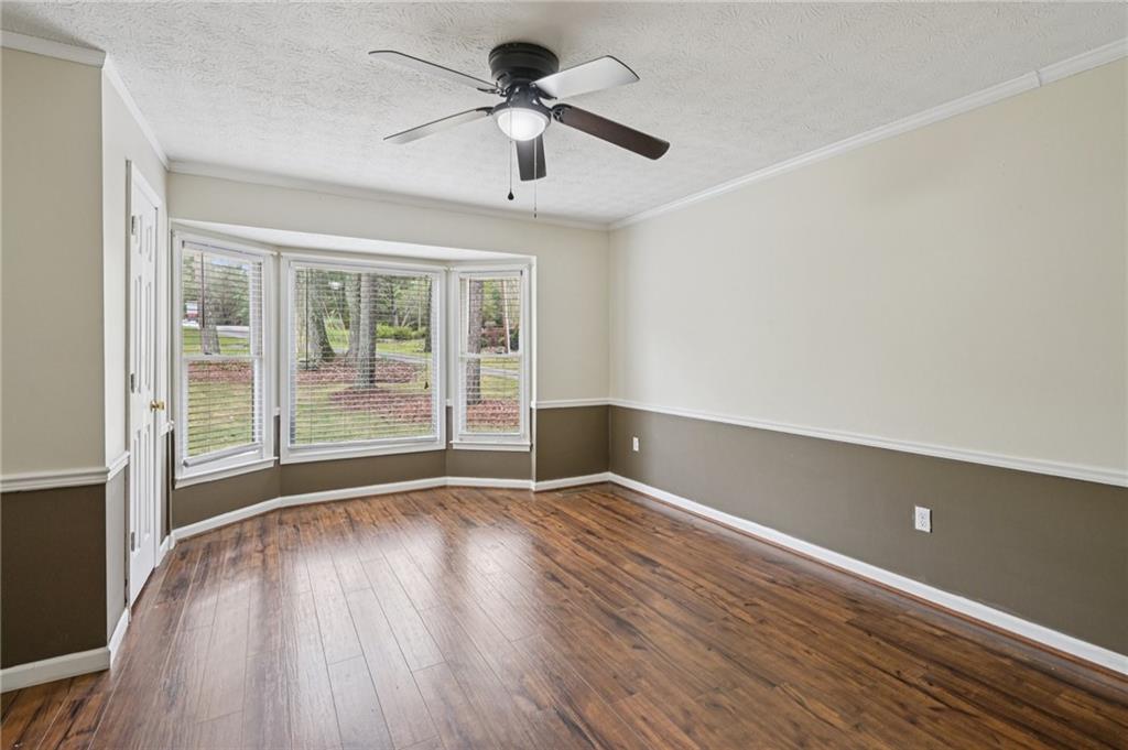 7379 North Mitchell Court Villa Rica, GA 30180 - Photo 24 of 82 a view of room with window ceiling fan and hardwood floor