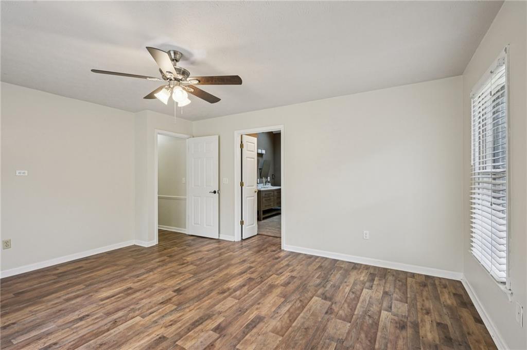 7379 North Mitchell Court Villa Rica, GA 30180 - Photo 32 of 82 a view of empty room with wooden floor and fan
