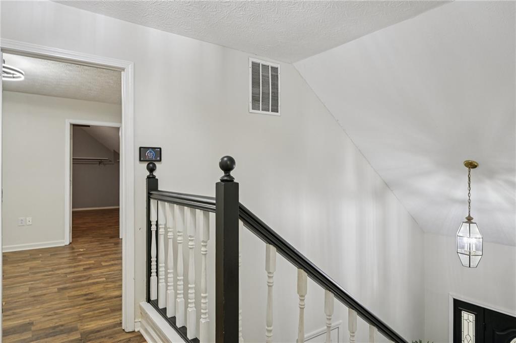 7379 North Mitchell Court Villa Rica, GA 30180 - Photo 37 of 82 a view of a hallway with front door and wooden floor