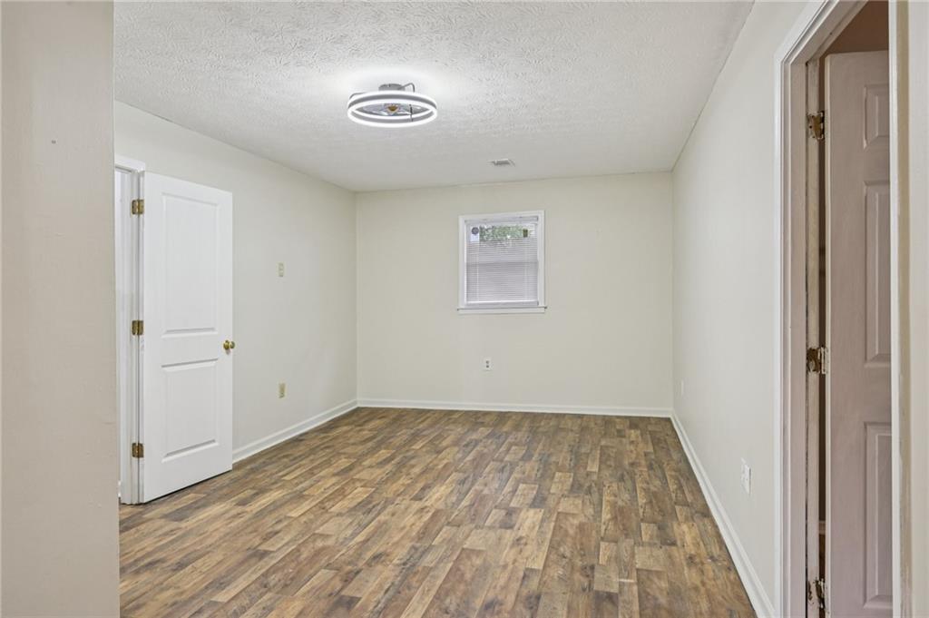 7379 North Mitchell Court Villa Rica, GA 30180 - Photo 38 of 82 a view of a room with wooden floor and a window