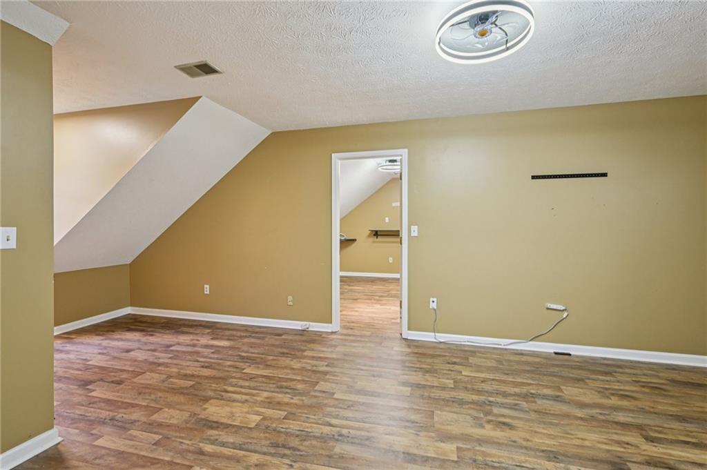 7379 North Mitchell Court Villa Rica, GA 30180 - Photo 43 of 82 a view of empty room with wooden floor