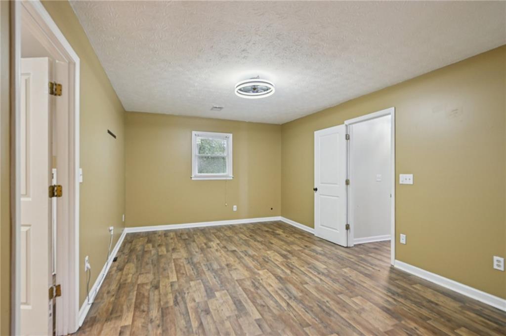 7379 North Mitchell Court Villa Rica, GA 30180 - Photo 44 of 82 a view of a room with wooden floor and a bathroom