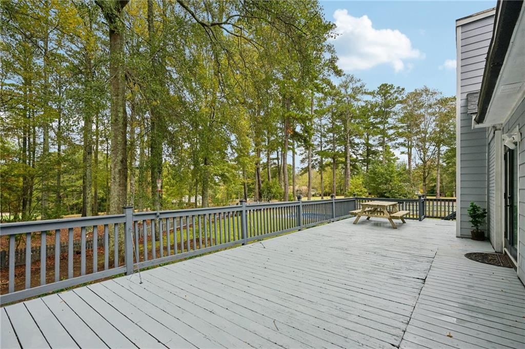 7379 North Mitchell Court Villa Rica, GA 30180 - Photo 49 of 82 a view of a deck with chairs and wooden fence