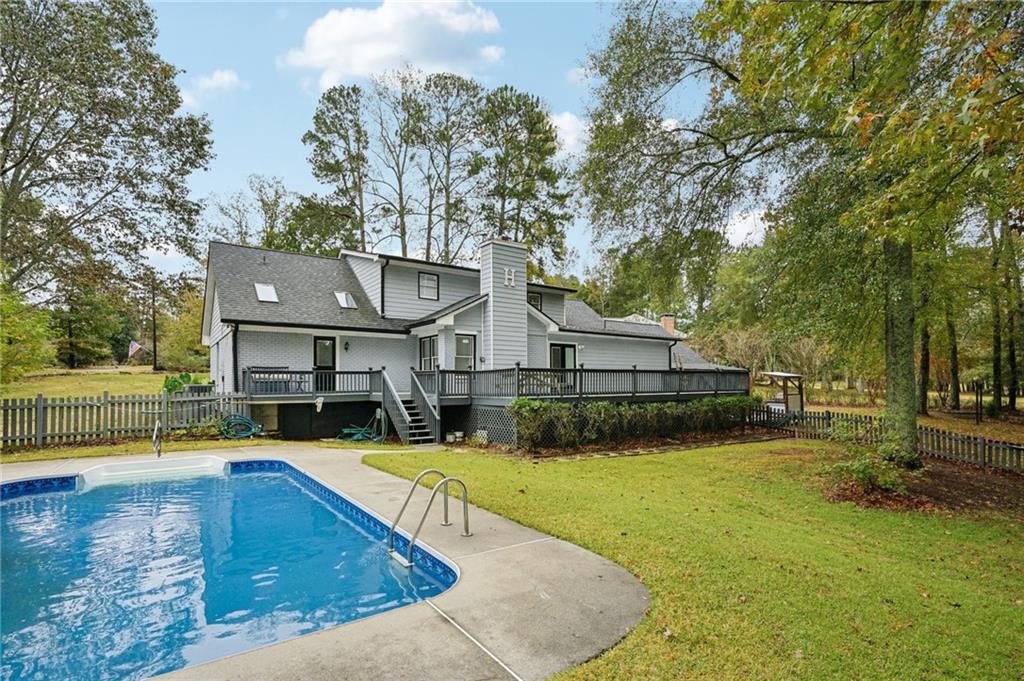 7379 North Mitchell Court Villa Rica, GA 30180 - Photo 53 of 82 a view of a house with swimming pool and sitting area