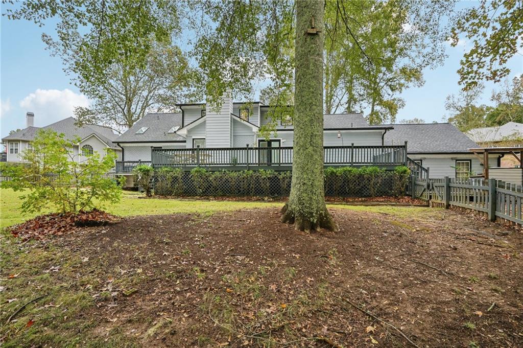7379 North Mitchell Court Villa Rica, GA 30180 - Photo 54 of 82 a view of a yard in front of a house with large trees