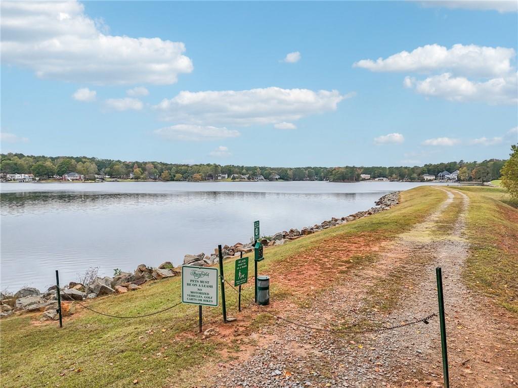 7379 North Mitchell Court Villa Rica, GA 30180 - Photo 62 of 82 a view of a lake with a big yard