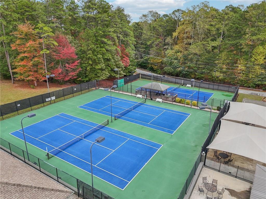 7379 North Mitchell Court Villa Rica, GA 30180 - Photo 78 of 82 a view of a tennis ground with large trees