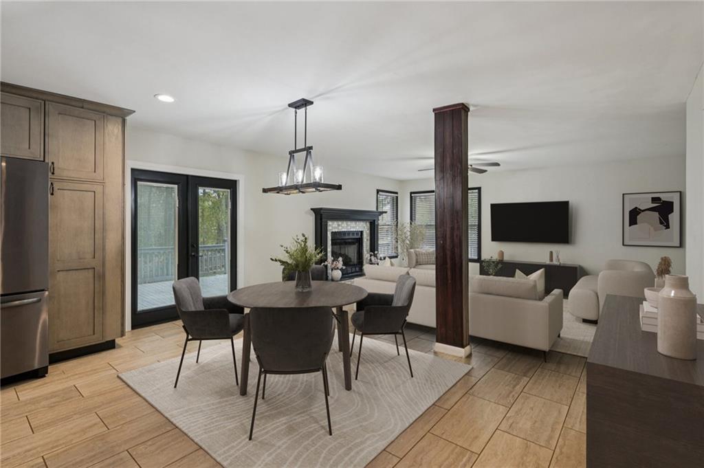 7379 North Mitchell Court Villa Rica, GA 30180 - Photo 10 of 82 a view of a livingroom with furniture a fireplace and a flat screen tv
