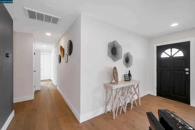 a kitchen with stainless steel appliances granite countertop a sink a stove and cabinets