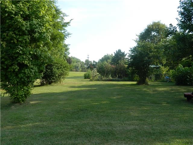 230 Curd Road Mount Juliet, TN 37122 - Photo 12 of 13 a view of a grassy field with trees