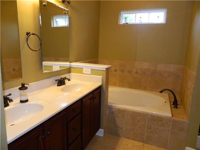 230 Curd Road Mount Juliet, TN 37122 - Photo 7 of 13 a bathroom with a sink and a bathtub