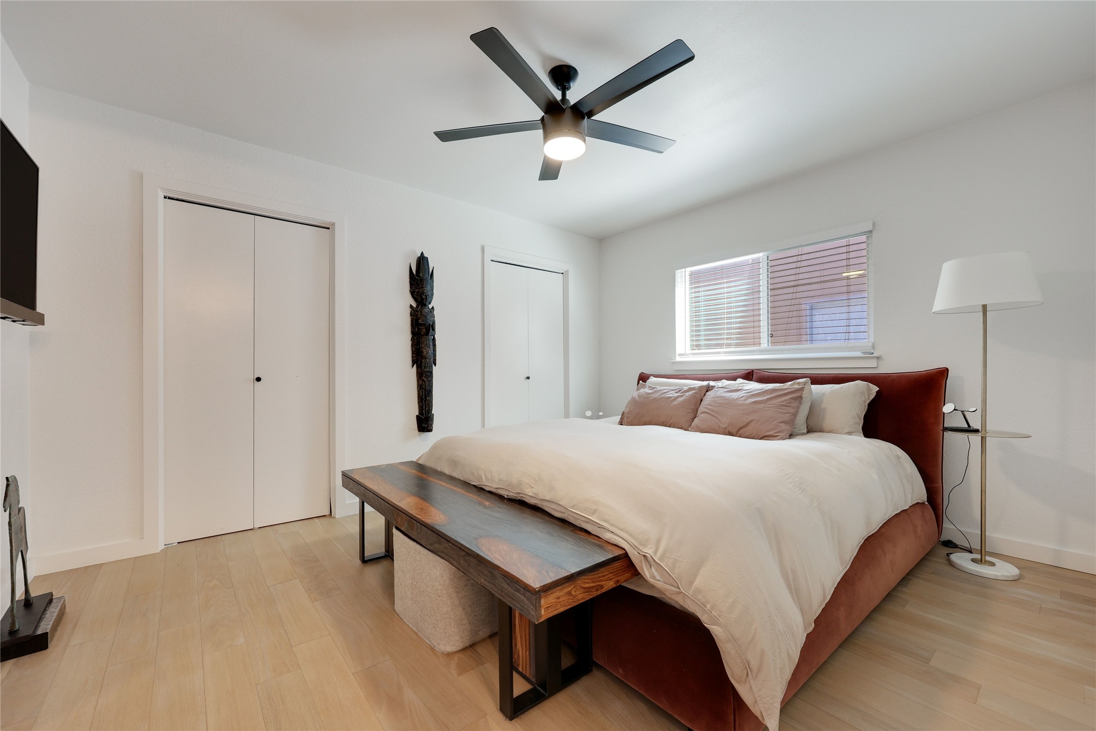 7902 Copano Drive Austin, TX 78749 - Photo 13 of 25 a bedroom with bed and a chandelier