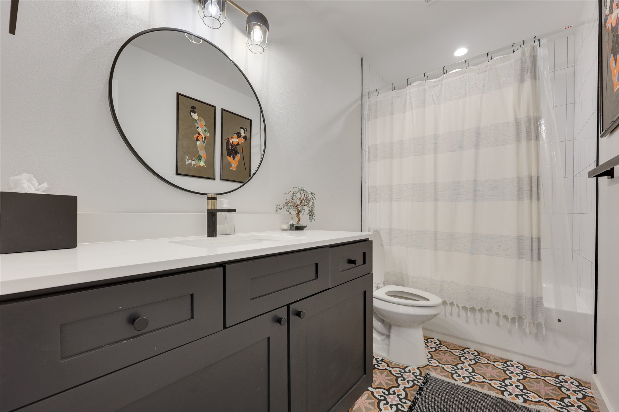 7902 Copano Drive Austin, TX 78749 - Photo 18 of 25 a bathroom with a sink a toilet and a mirror