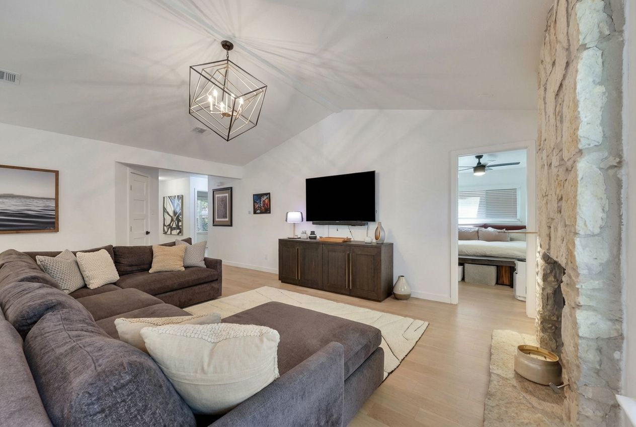 7902 Copano Drive Austin, TX 78749 - Photo 7 of 25 a living room with furniture and a flat screen tv
