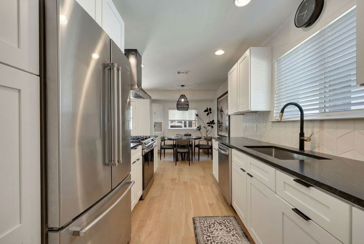 7902 Copano Drive Austin, TX 78749 - Photo 10 of 25 a kitchen with a sink stainless steel appliances and cabinets