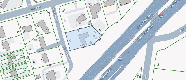 a view of a balcony with wooden floor and door