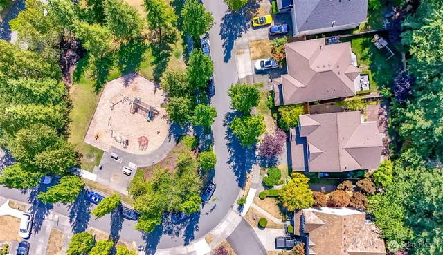 an aerial view of a house with a swimming pool