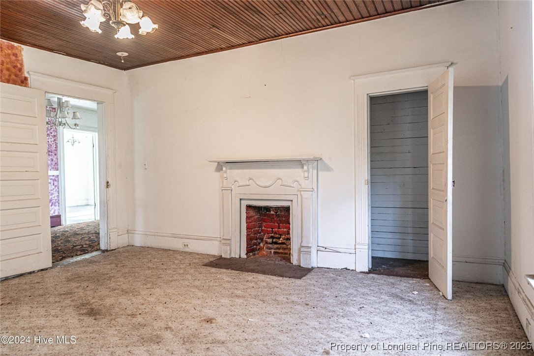 801 Monroe Street Carthage, NC 28327 - Photo 11 of 20 a view of an empty room with a fireplace