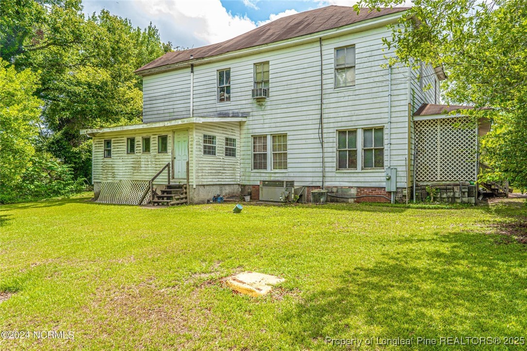 801 Monroe Street Carthage, NC 28327 - Photo 7 of 20 a front view of house with yard and seating area