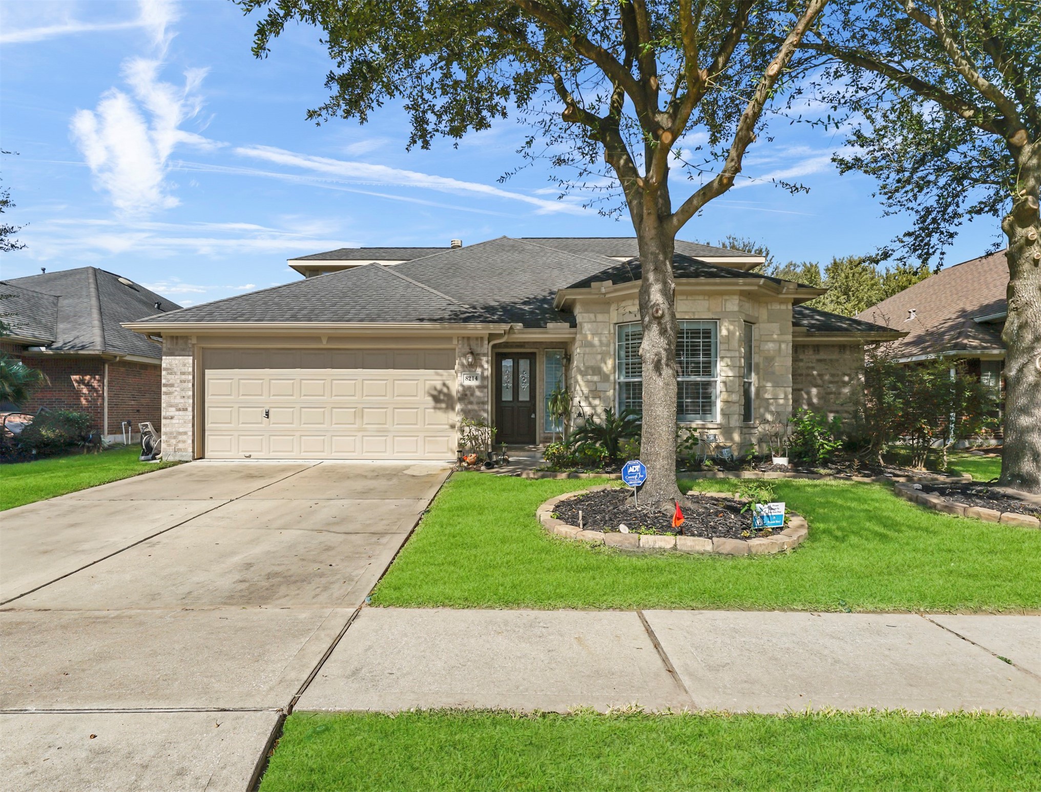8214 Garrison Point Drive Houston, TX 77040 - Photo 1 of 37 a front view of a house with a yard