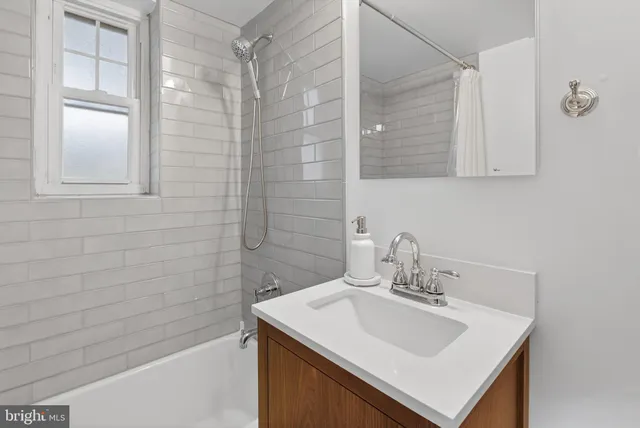 a bathroom with a sink a vanity and a mirror