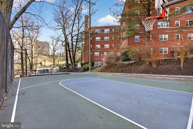 a view of a street with a building in the background