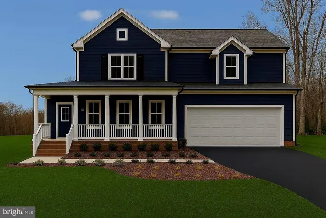 a front view of a house with a small yard