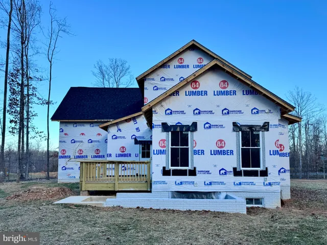 a front view of a house with fountain