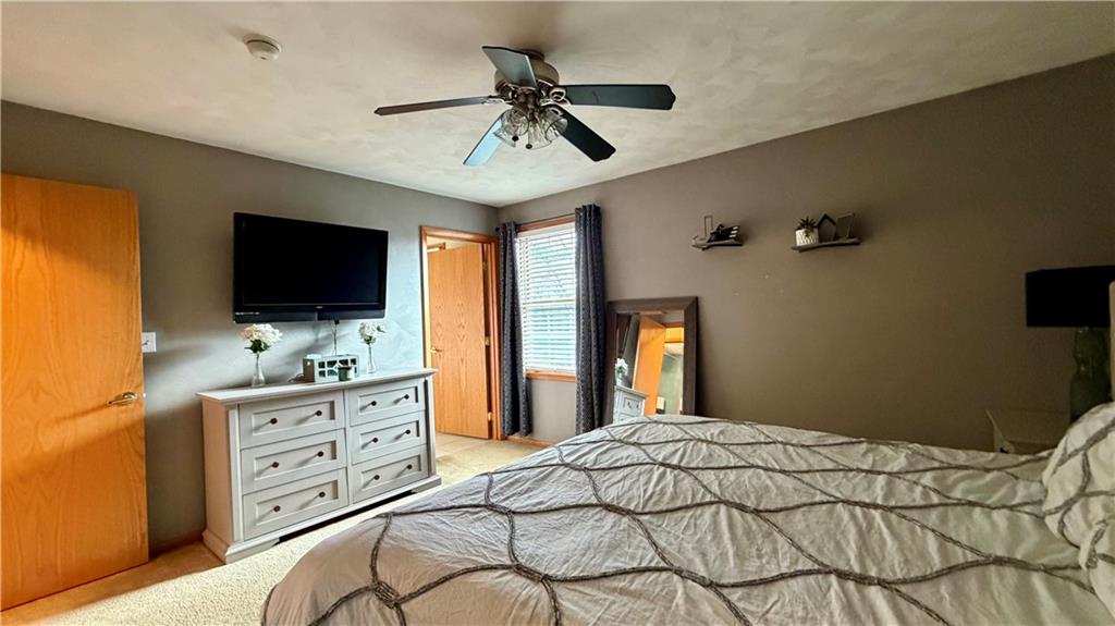 6949 Shannon Road Verona, PA 15147 - Photo 19 of 49 a bedroom with a bed and a flat screen tv