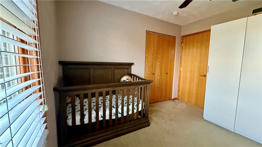 6949 Shannon Road Verona, PA 15147 - Photo 24 of 49 a bedroom with a bed and a window