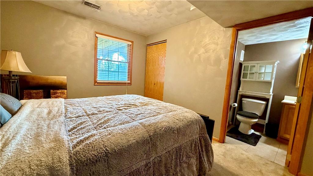 6949 Shannon Road Verona, PA 15147 - Photo 33 of 49 a bedroom with a bed and a mirror