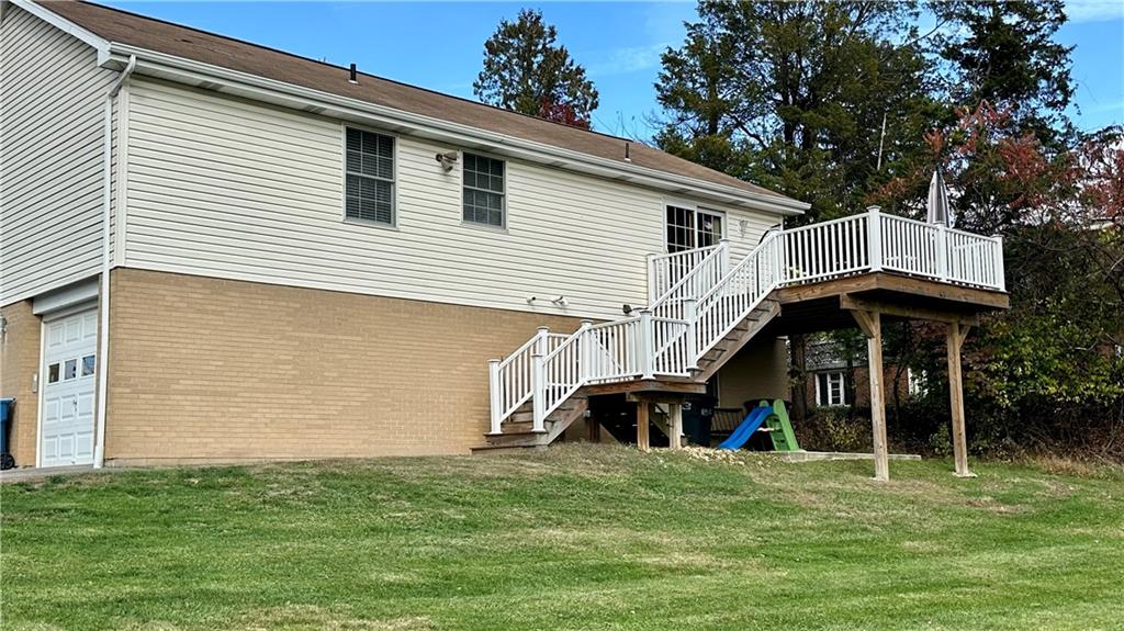6949 Shannon Road Verona, PA 15147 - Photo 45 of 49 a front view of a house with a garden