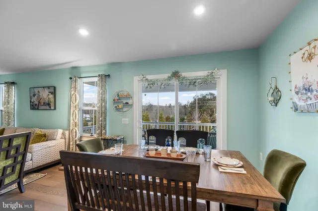 a kitchen with a sink a refrigerator a stove and cabinets