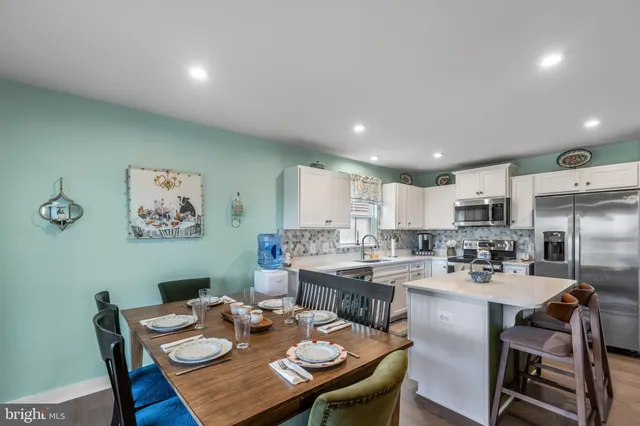 a kitchen with a sink stove and refrigerator
