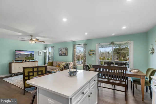 a bedroom with a bed and ceiling fan