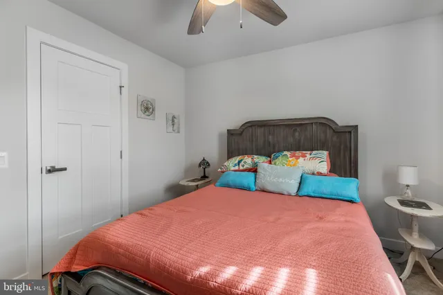 a view of a house with a big yard and large trees