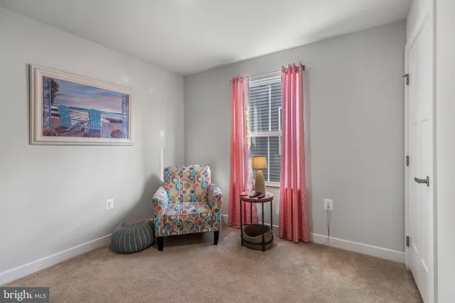 a view of a big house with a big yard and large trees
