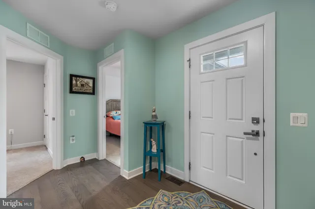 a view of room with window and wooden floor