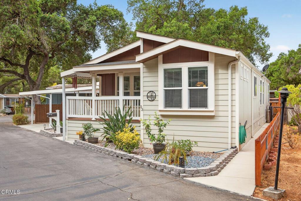 1273 South Rice Road, Unit 53 Ojai, CA 93023 - Photo 1 of 42 a view of a house with a yard and potted plants
