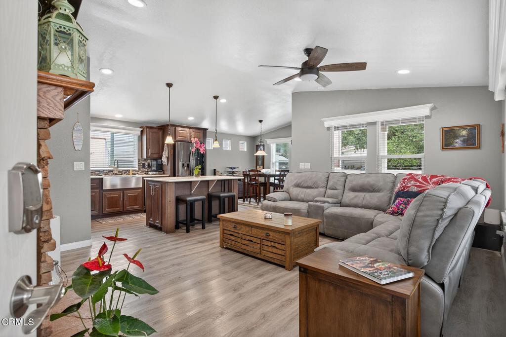 1273 South Rice Road, Unit 53 Ojai, CA 93023 - Photo 13 of 42 a living room with furniture kitchen view and a wooden floor