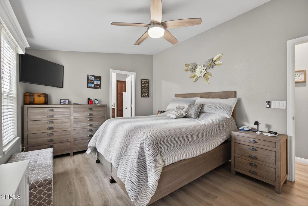 1273 South Rice Road, Unit 53 Ojai, CA 93023 - Photo 16 of 42 a bedroom with a bed and a flat screen tv