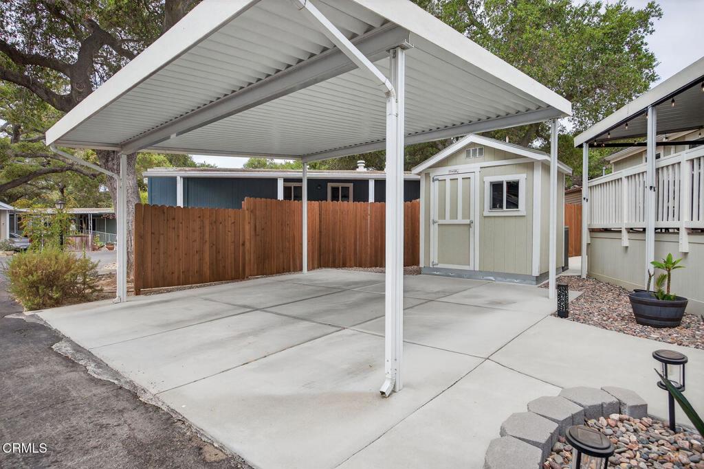 1273 South Rice Road, Unit 53 Ojai, CA 93023 - Photo 30 of 42 a patio with a table and chairs and potted plants
